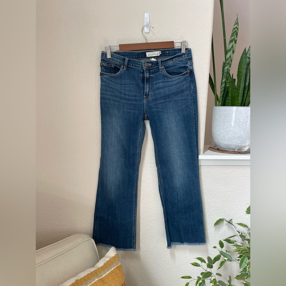 Boot cut frayed jeans